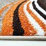 Enigma New / 307-78 Brown-orange - detail povrchu a obšití (bok)